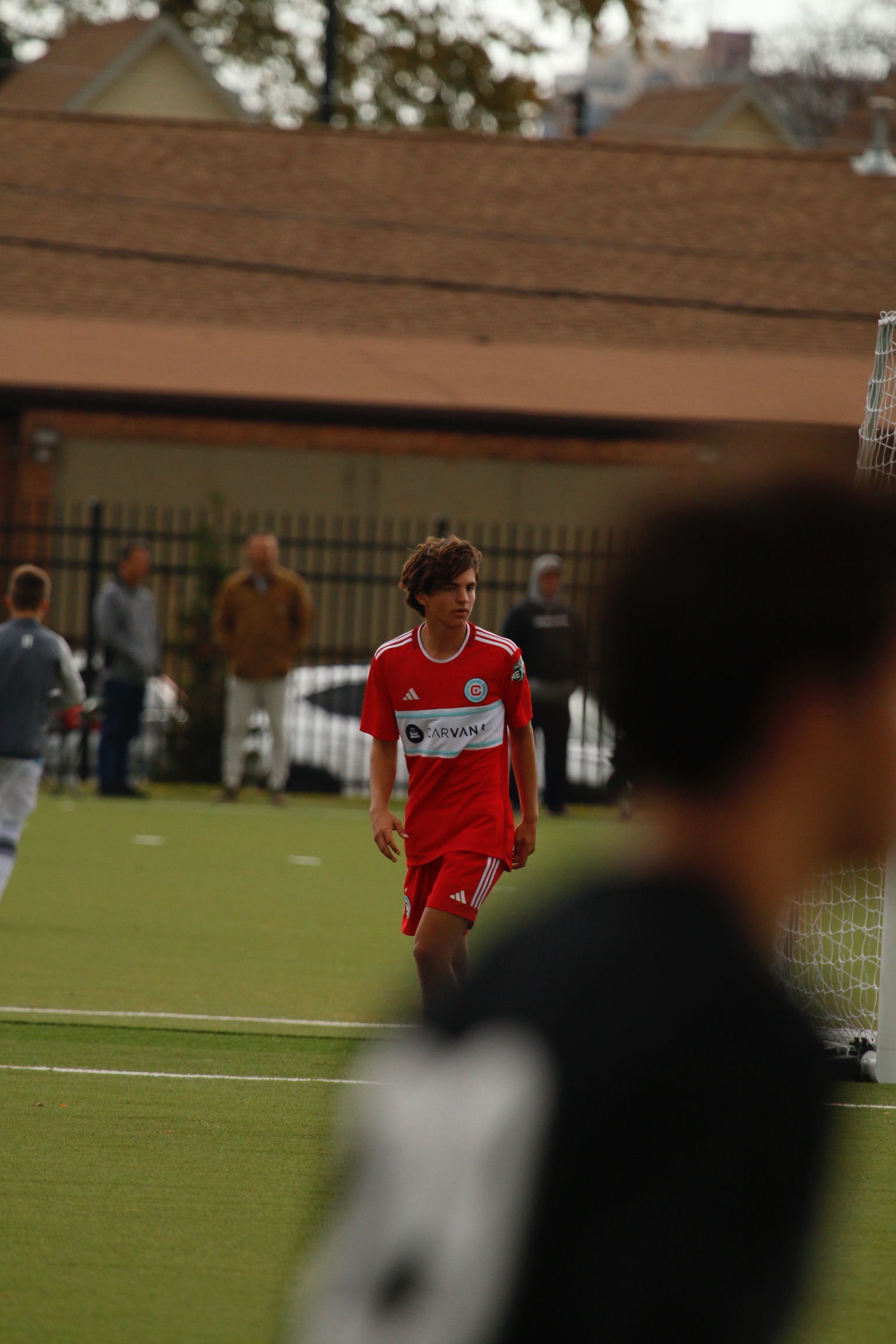 Soccer player dribbling ball during outdoor match - Sports action photography Naperville