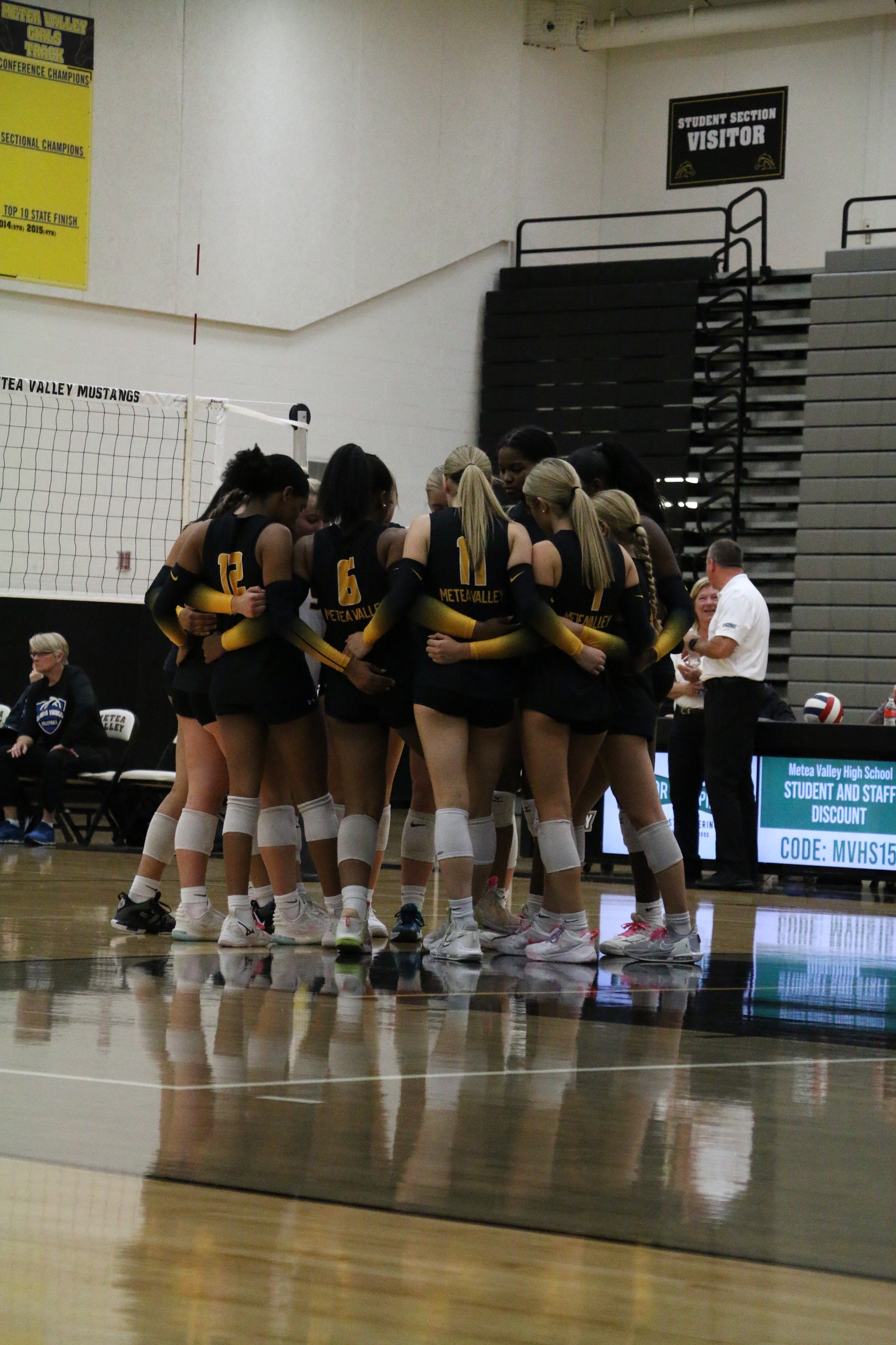 Female volleyball player spiking ball during high school game - TMM Photography Naperville