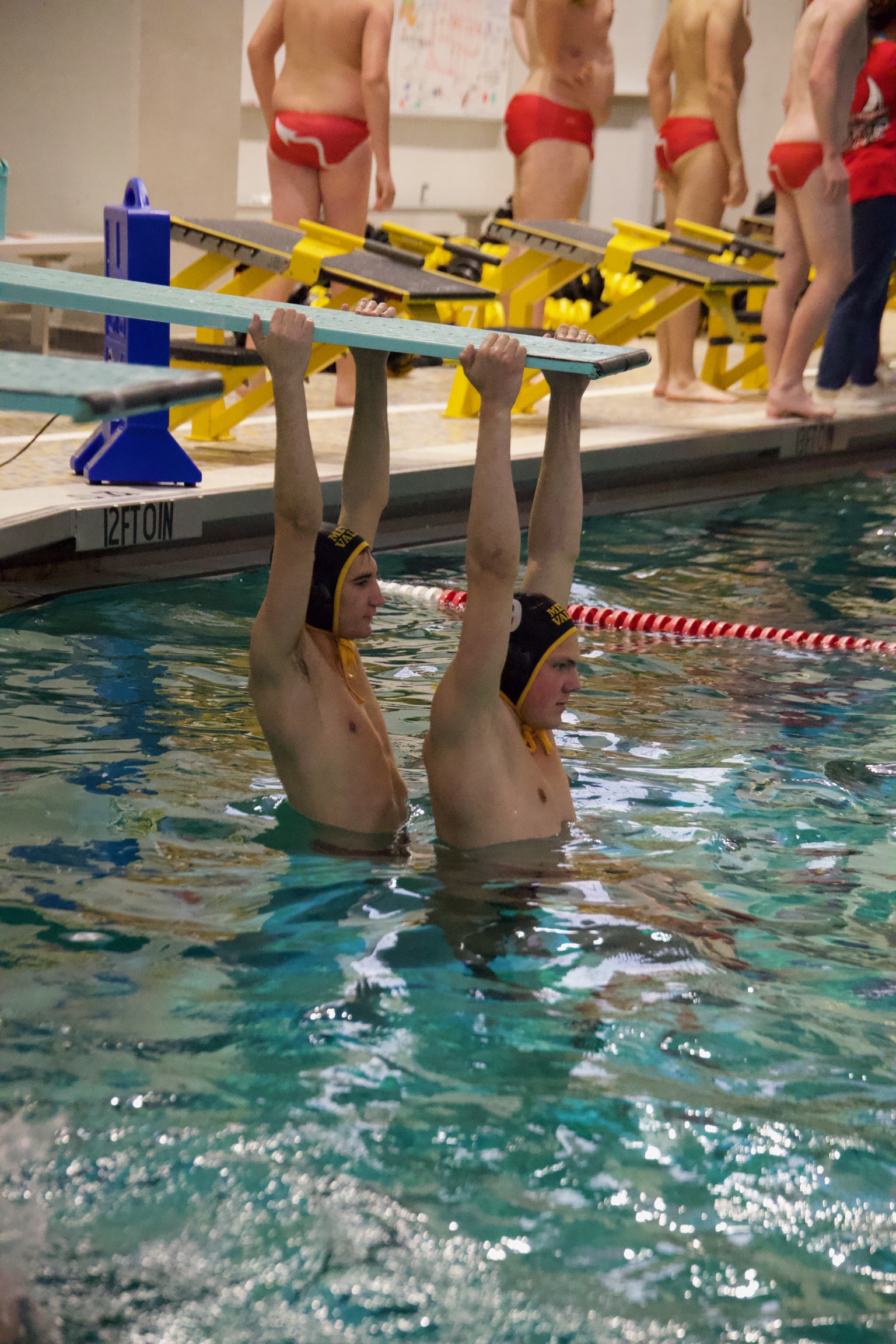 Water polo player in pool during competitive match - Athletic photography by TMM Photography